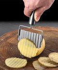 Stainless steel ripple potato slicer crinkle cutter set (2-pack) slicing a potato on a wooden board