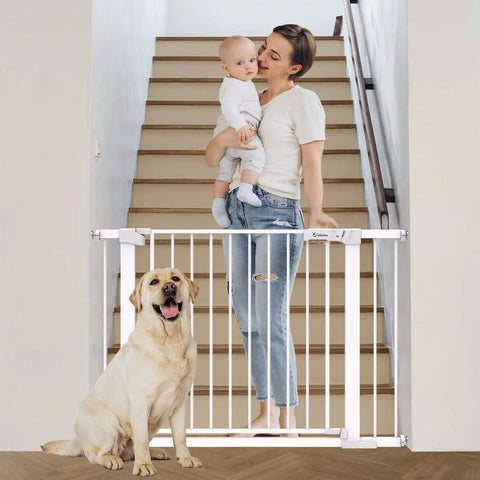Mother holding baby and dog beside Extra Wide Auto Close Baby Gate With Easy Walk Through For Stairs And Doorways Pressure Mounted No Drilling