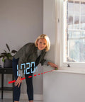 Pro 20 Meter Laser Distance Meter With Clear Digital Screen And Continuous Measurement Mode in use measuring 17.20m indoors.