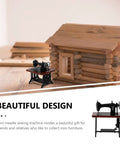 Authentic Vibes Rad Tiny 1/24 Scale Miniature Sewing Machine Dollhouse Replica And Home Decor Ornament Super Detailed Tabletop Accessory For Craft Rooms And Serious Collectors next to a log cabin.