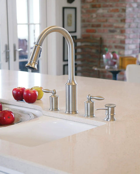 Deck Mounted Kitchen Soap Dispenser With Refillable Bottle Above The Sink In Oil Rubbed Bronze Finish next to faucets on marble countertop