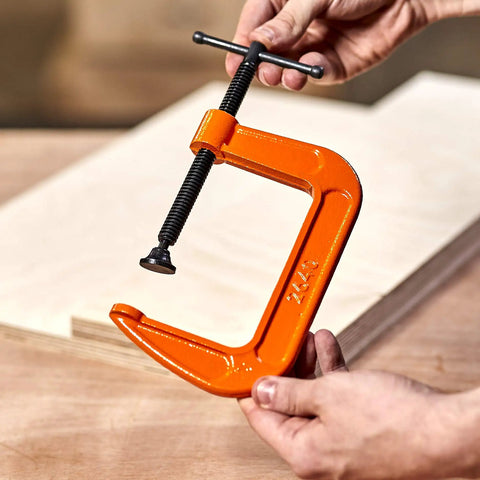 4-Inch C Clamp With 400 LB Clamping Force For DIY Projects And Light Woodworking, Zinc Plated Acme Screw, 3 Inch Throat, shown in hand