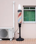 3 Inch Wide 10 Foot Line Set Cover Kit for Mini Split AC Systems next to barber pole outside a building