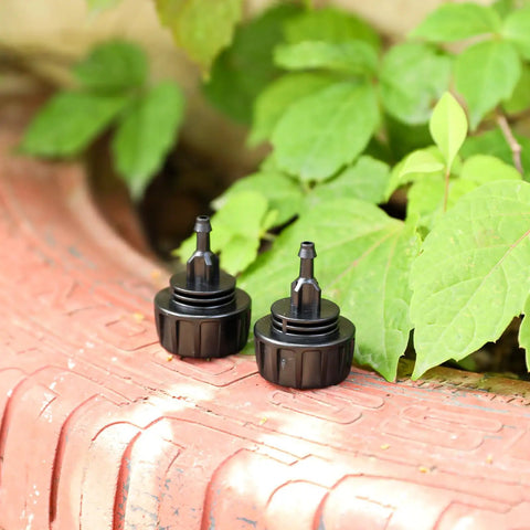 Five Pack One Quarter Inch Drip Irrigation Tubing To Faucet And Garden Hose Adapters Quick Connect Fittings on red surface