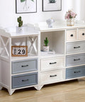 Modern dresser with multicolored drawers and decorative items on top, featuring matte black cabinet pulls.