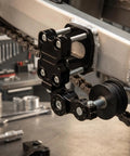 Motorcycle Chain Adjuster With Precision Roller Wheel Anodized Aluminum Tensioner Tool For Grease Monkey Approved Bike Mods And Serious Weekend Wrenching Blue installed on a motorcycle.