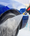 Heavy Duty Pressure Washer Short Gun With Swivel, 5000 PSI 10.5 GPM cleaning car wheel surface, showing water spray and nozzles.
