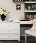 Room with white dresser featuring 30 pack solid kitchen cabinet round knobs and dresser pulls gold brushed brass cupboard hardware for doors and drawers one and one quarter inch top diameter beefy heavy duty build for long lasting use.