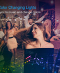33 Feet LED Strip Lights With App Control And Voice Assistant Compatibility RGB Color Changing Lit Mood Lights For Bedroom Decor Fully Smart Color Spectrum Ambience Works With Alexa And Google Assistant in a party setting with people dancing and playing guitar