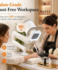 Top Shelf Quiet Nail Dust Collector Vacuum Fan With Adjustable Suction Reusable Filter And Smooth Cyclone Airflow in salon setting, capturing nail dust.
