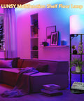 Smart RGB Shelf Floor Lamp With USB Ports And Power Outlet in vibrant living room, modern black design with shelves and soft fabric shade.