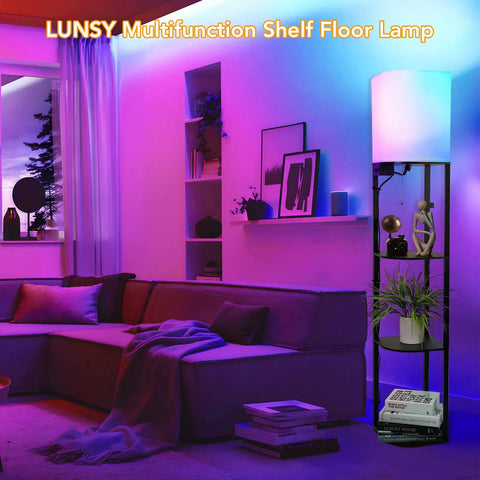 Smart RGB Shelf Floor Lamp With USB Ports And Power Outlet in vibrant living room, modern black design with shelves and soft fabric shade.