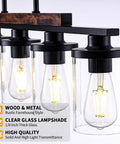 Close-up of Modern Farmhouse 5 Light Linear Chandelier for Kitchen Island and Dining Room with clear glass shades glowing.