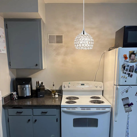 Three Light Black Hanging Ceiling Light Chandelier With Crystal Accents in a modern kitchen setting