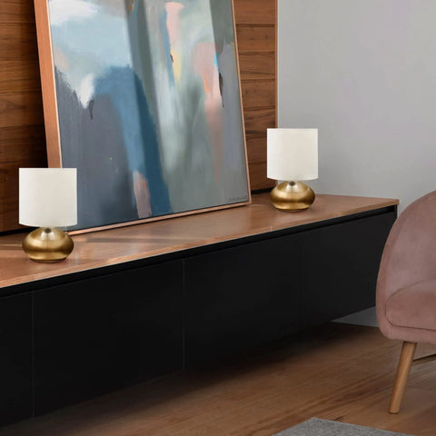 Transitional Small Touch Lamp Set in Antique Brass, 9.25 Inch Tall on modern console with abstract art backdrop.