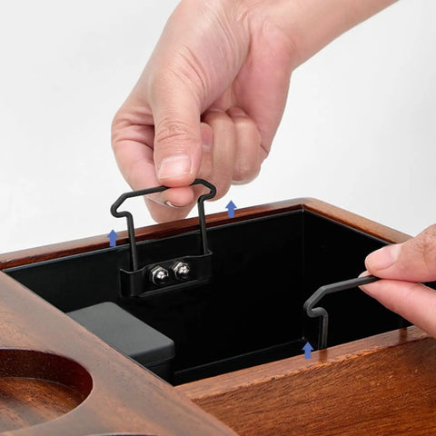Hand adjusting the integrated knock box in the Solid Wood Espresso Tamper Holder Combo With Integrated Knock Box And Grounds Bin.