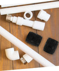 Two Pack Tubing Reamer Tool Set For Pipes Inner And Outer Deburring Chamfering To Remove Burrs And Rough Edges Heavy Duty Deburrer for copper and PVC with fittings on wood surface.