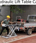Heavy Duty Portable Hydraulic Lift Table Cart With Electric Motor and Strong Steel Shear Fork for Moving Heavy Loads Up to 660 Lbs safely in warehouse.