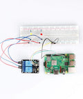 Two Channel 5V Relay Module With Optocoupler Low Level Trigger Expansion Board Plug And Play For Arduino Raspberry Pi ESP32 ESP8266 And Broad Microcontroller Compatibility connected to solderless breadboard and Raspberry Pi