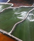 Close-up of glass art with Artist Pure 60/40 Stained Glass Solder Wire 0.125 Inch Thick 1lb Spool For Copper Foil And Came Lead Work