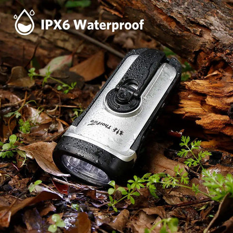 Go To Solar Powered Hand Crank Flashlight For Camping And Outdoors, IPX6 Waterproof Emergency LED Torch in wet forest