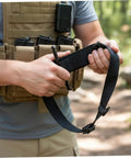 Person holding Two Pack Gen 4 Tactical Tourniquets With Metal Twisting Rods, 1.5 Inch Compression Band in hands outdoors