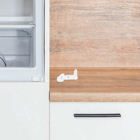 Heavy Duty Plastic Freezer Door Stop For Fridge Repair on wooden countertop, easy DIY installation for door hinge damage prevention.