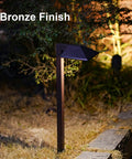 Bronze light from Low Voltage Landscape Path Lights 8 Pack Kit LED 22 Lumen Outdoor Walkway Pathway Lighting Wired Bronze Finish 3100K Warm White With Cable Connectors Easy Install For Your Yard illuminating path