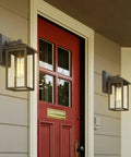 2 Pack Outdoor Wall Sconces Lantern Lights With Seeded Glass In Black Finish on house exterior next to red door, IP44 Rated