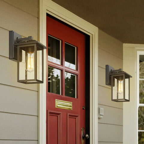 2 Pack Outdoor Wall Sconces Lantern Lights With Seeded Glass In Black Finish on house exterior next to red door, IP44 Rated