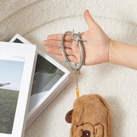 Star Shaped Carabiner Keychain With Belt Loop Clip Silver Cool Durable Stainless Steel Heavy Duty Snap Hook For Everyday Carry Bags Keys And Y2K Starlight Aesthetic in hand with plush accessory
