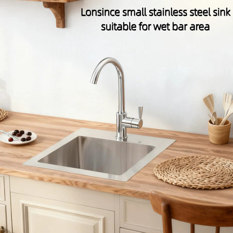 Drop In Bar Sink 15 By 15 Inch 16 Gauge Stainless Steel installed on wooden countertop in wet bar area with accessories.