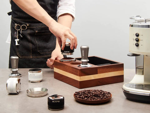 Person using 53mm Espresso Tamper Pro Grade Barista Coffee Tamper With Calibrated Spring Loaded And 100 Percent Flat Stainless Steel Base.