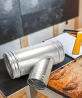 Straight Up Heavy Duty 6 To 4 Inch Branch Y Shaped Ducting Connector Featuring 45 Degree Galvanized Splitter on a wooden surface.