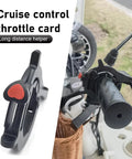 Universal Motorcycle Throttle Cruise Control Booster with Anti Slip Grip on handlebar for long highway rides in matte black.