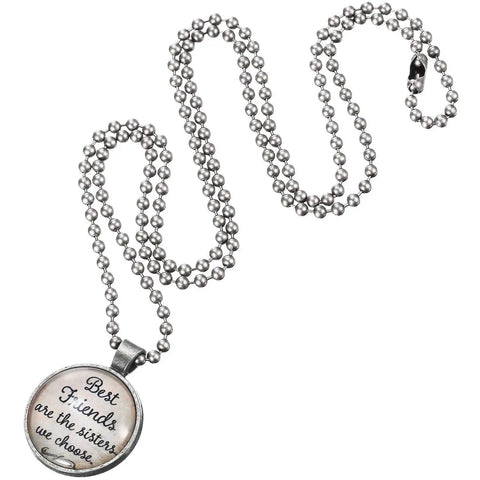 Silver bead chain necklace with round pendant inscribed 'Best friends are the sisters we choose' on a white background.