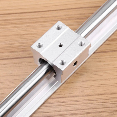 Real Deal SBR12 Linear Rail Shaft Set Built Tough With Four Matching Bushings Featuring Pre Drilled Mounting Holes For CNC Routers 3D Printers And Robotics Projects, close-up of bearing block on steel shaft.