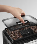 Super Automatic Espresso Machine With A Quiet Built In Grinder And One Touch Milk Frother Making Killer Daily Brews Using 15 Bar Pressure For A Smooth Relaxing Morning Routine In Sleek Silver Finish with coffee beans visible under lid.