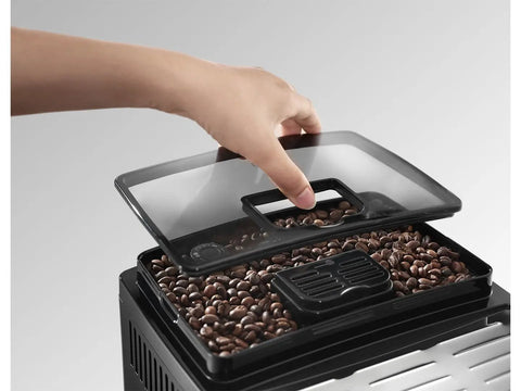 Super Automatic Espresso Machine With A Quiet Built In Grinder And One Touch Milk Frother Making Killer Daily Brews Using 15 Bar Pressure For A Smooth Relaxing Morning Routine In Sleek Silver Finish with coffee beans visible under lid.
