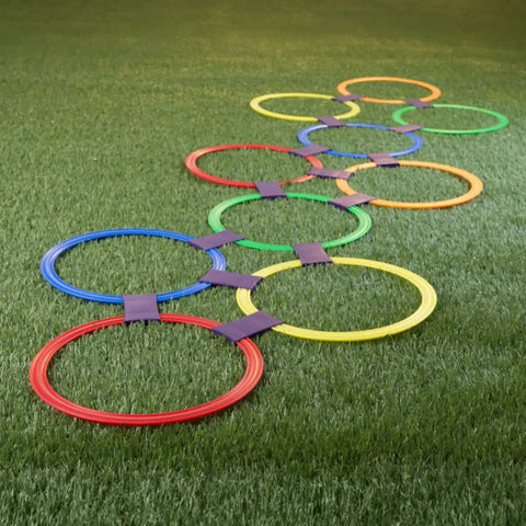 Hopscotch Rings Game Kit With Ten 11 Inch Plastic Rings And Fifteen Connectors for outdoor fun on grass.