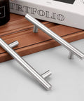 Brushed Nickel Finish Cabinet Handles And Drawer Pulls Stainless Steel Hollow Tubes 6 Inch Overall Length placed on wooden surface