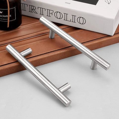 Brushed Nickel Finish Cabinet Handles And Drawer Pulls Stainless Steel Hollow Tubes 6 Inch Overall Length placed on wooden surface