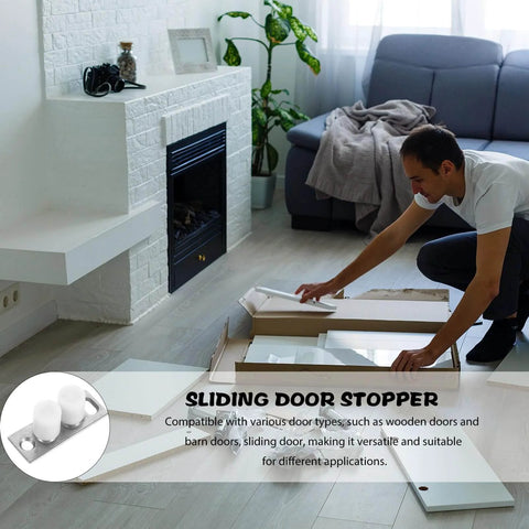 Man assembling Barn Door Roller Guide And Floor Guide Kit for smooth quiet glide operation in living room next to sofa.