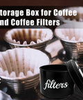 Black coffee filter holder with lid in front of metal filter baskets.