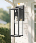Dusk To Dawn Sensor Outdoor Wall Lantern 15 Inch Tall Anti Rust Black Exterior Light mounted on house wall with bulb