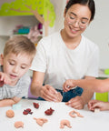 Children learning with 8 Pack Mini Human Body Organ Models, 3D realistic anatomy set featuring heart, brain, lungs, great for education.