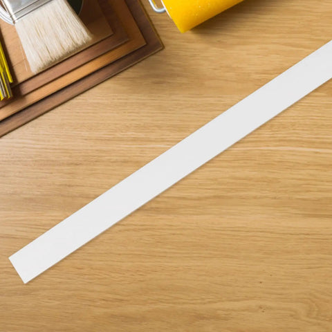 Self Adhesive Cable Raceway Pvc Cord Cover Peel And Stick Wire Organizer laid on wooden surface, 1-inch width, ideal for cable concealment.