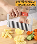 Hand using Heavy Duty Crinkle Cutter For Potatoes And Veggies Stainless Steel With Wooden Handle Rust Resistant Wavy Knife on veggies