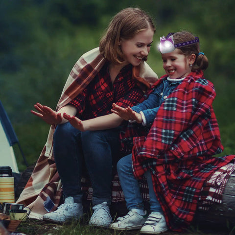Mother and daughter at campsite with Unicorn LED Headlamp For Kids And Adults, Totally Fun Toy Style Light Up Gear For Camping Running Hiking.
