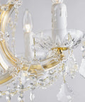 Close-up view of the Gold 5 Light Maria Theresa Crystal Chandelier With Adjustable Chain Up To 52 Inches E12 Bulb Ready LED Compatible Modern Luxury Ceiling Fixture For Bedroom Dining Room Living Room 19 By 19 Inches Lit Glam Glow, showing intricate crystal details and bulb holders.